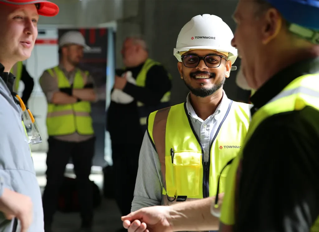 Group having a small discussion in prootective gear
